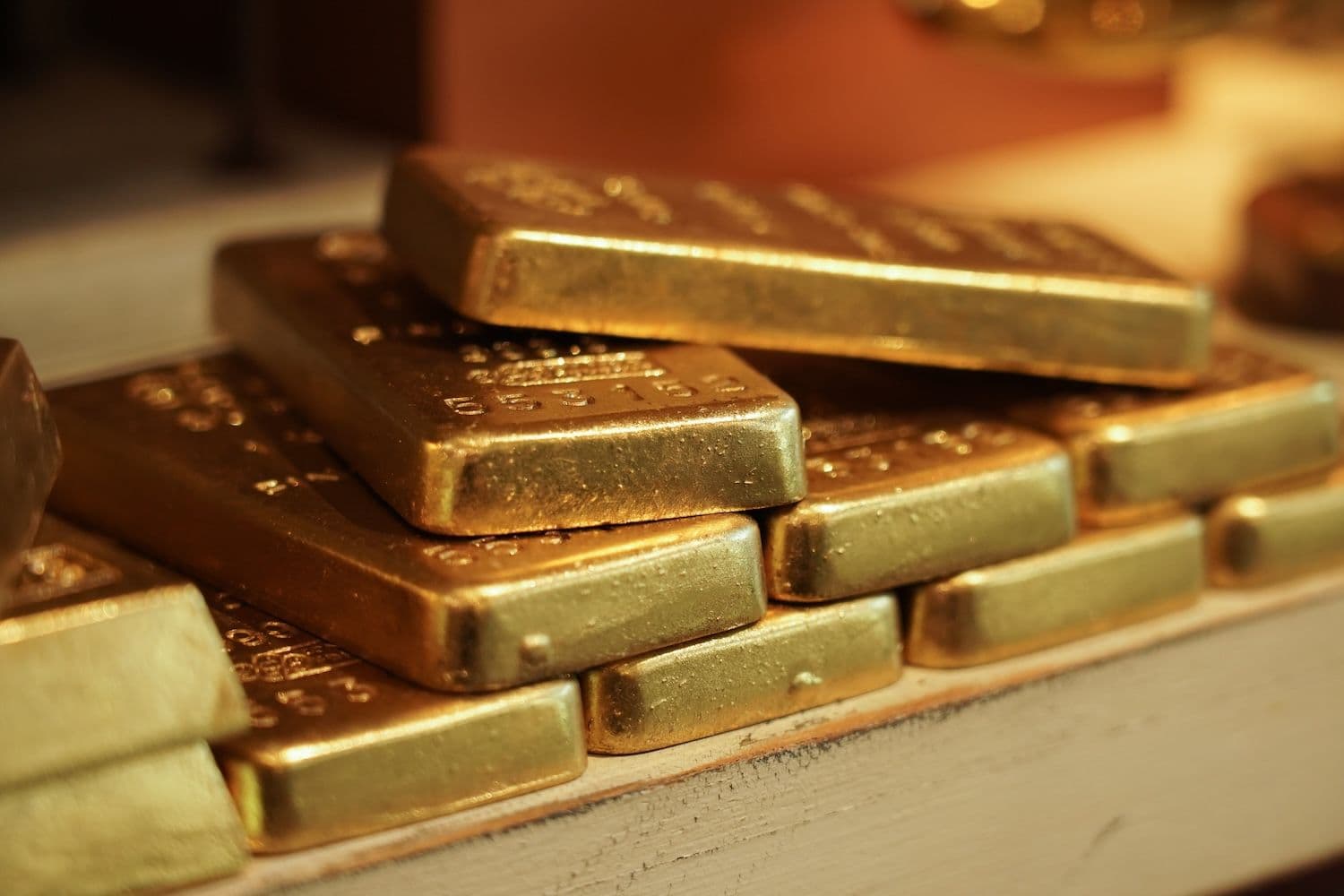 Bullion stacks evoke a record run of central bank buying even as gold prices and the dollar's dominance slip. (Image: Shutterstock)