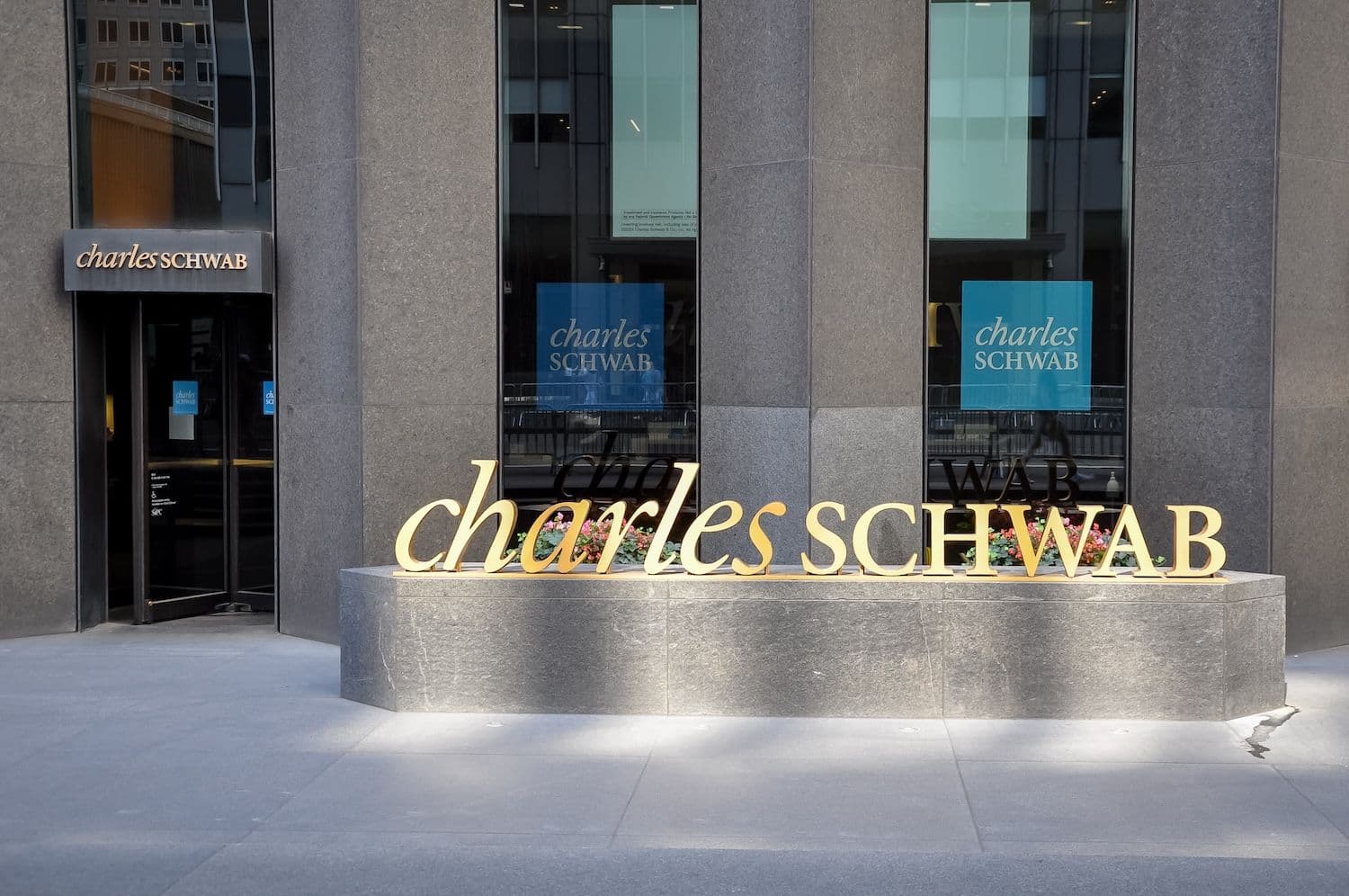 Wall Street brokerage Schwab is letting 39 million retail clients trade spot Bitcoin and Ether directly, with Paxos running execution at a 0.75% fee. (Image: Shutterstock)